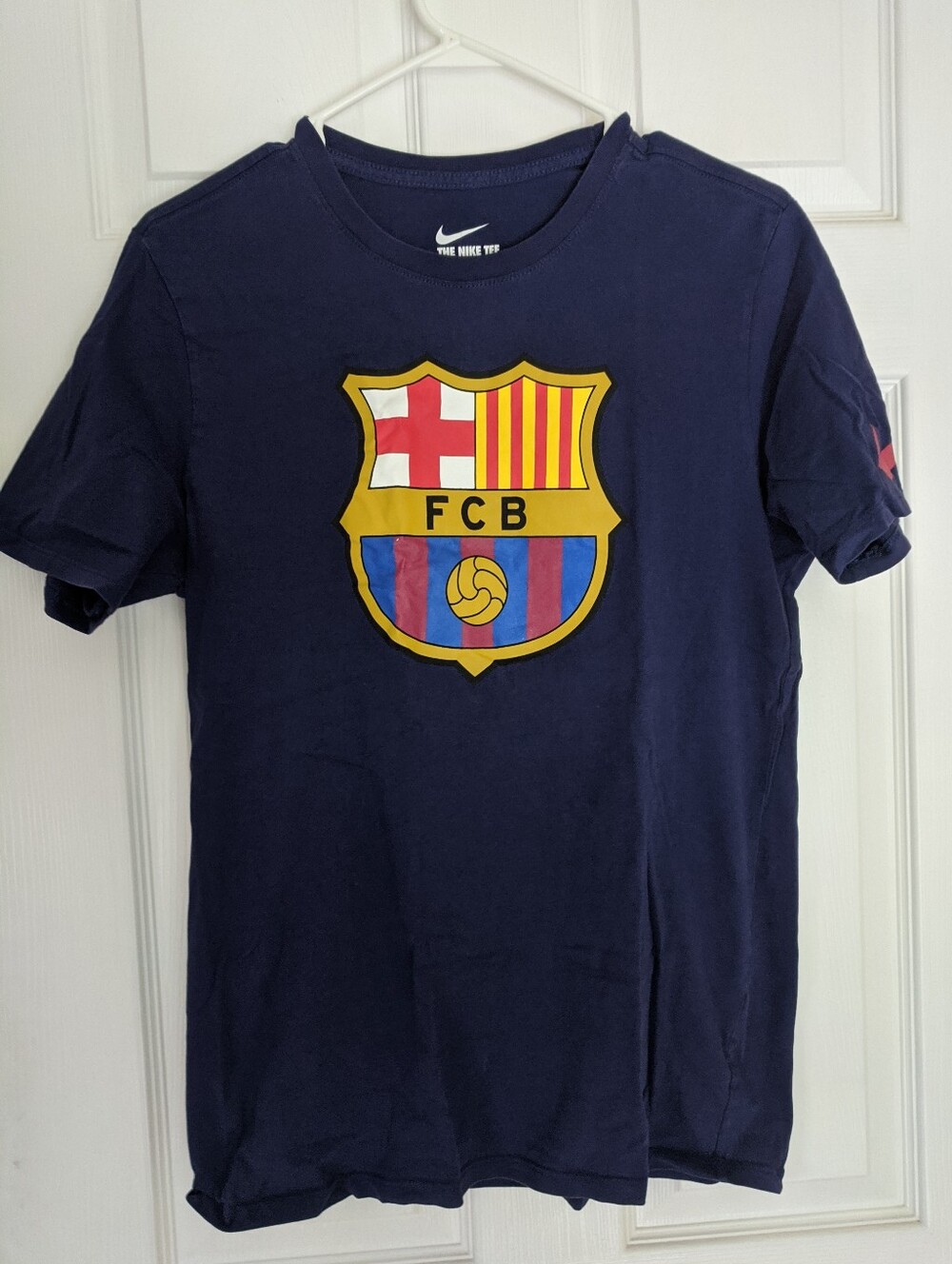 Two Nike Tee Shirts. Men's Navy T-Shirt with FC Barcelona Crest and Men's Blue